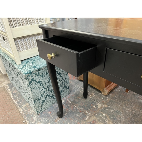 165 - A modern black painted two drawers console table - approx. 76cm high x 80cm wide x 40cm deep