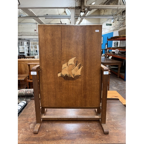 168 - A 1930s inlaid oak tilt top occasional table - approx. 46cm high when tilted x 52cm wide x 61cm long