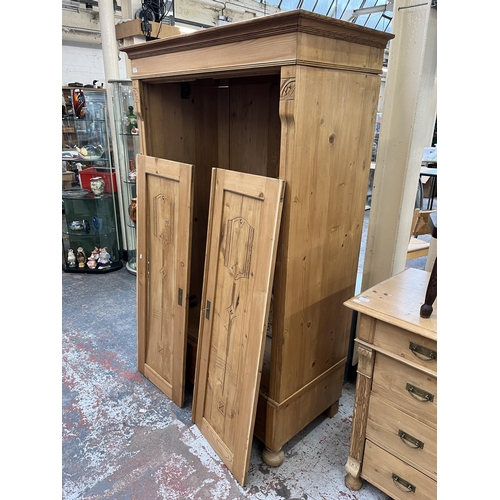 172 - An Art Nouveau pine double wardrobe - approx. 184cm high x 112cm wide x 59.5cm deep