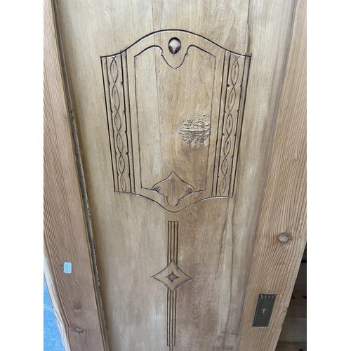 172 - An Art Nouveau pine double wardrobe - approx. 184cm high x 112cm wide x 59.5cm deep