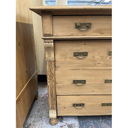 173 - An Art Nouveau pine chest of drawers - approx. 91cm high x 106cm wide x 54cm deep