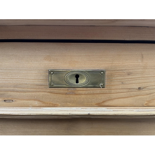 173 - An Art Nouveau pine chest of drawers - approx. 91cm high x 106cm wide x 54cm deep