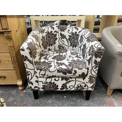 174 - A modern floral fabric upholstered armchair and footstool