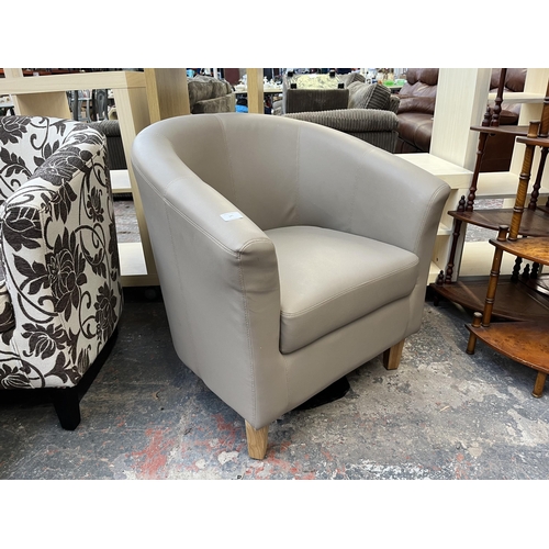 175 - A Sue Ryder grey leatherette armchair