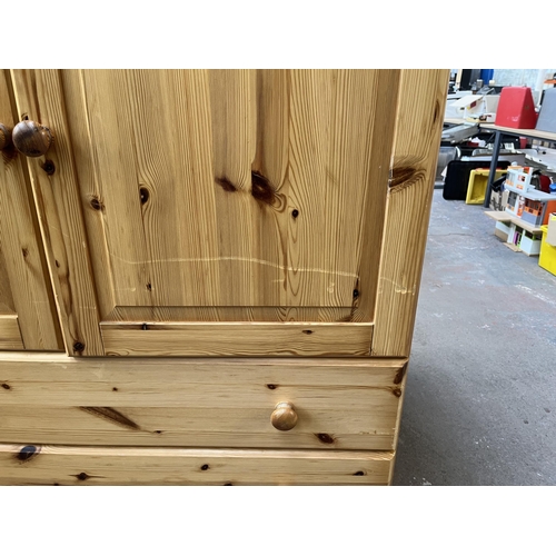 180 - A pine double wardrobe - approx. 178cm high x 103cm wide x 58cm deep