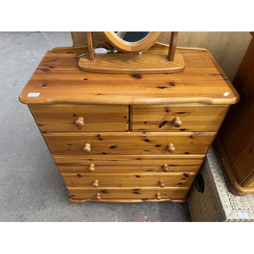 181 - A pine chest of drawers and dressing table mirror - approx. 97cm high x 80cm wide x 40cm deep