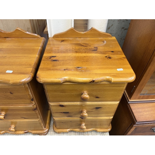 182 - A pair of pine bedside chests of drawers - approx. 62cm high x 43cm wide x 39cm deep