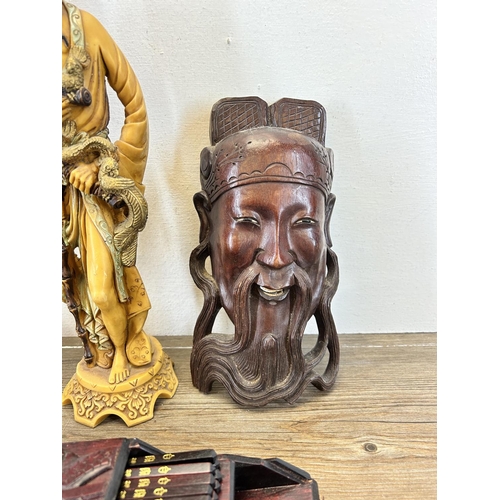 503 - Four Oriental items, carved hardwood chopstick case with dragon design, carved hardwood elder wall m... 