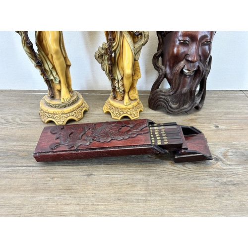 503 - Four Oriental items, carved hardwood chopstick case with dragon design, carved hardwood elder wall m... 