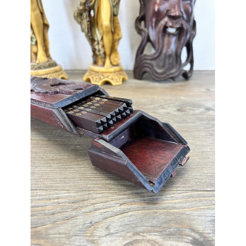 503 - Four Oriental items, carved hardwood chopstick case with dragon design, carved hardwood elder wall m... 