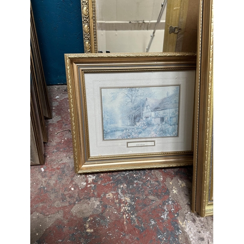 202 - Six gilt framed items, three wall mirrors and three prints - largest approx. 84cm high x 108cm wide