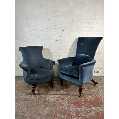18 - Two Victorian blue fabric upholstered armchairs with turned wooden supports and castors