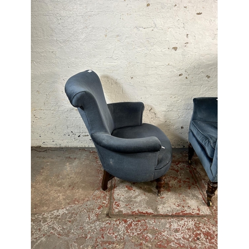 18 - Two Victorian blue fabric upholstered armchairs with turned wooden supports and castors