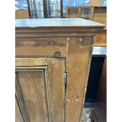 26 - A Victorian pine single door cupboard - approx. 135cm high x 83cm wide x 52cm deep