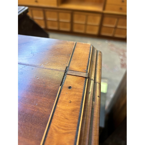 27 - A Georgian mahogany bow fronted chest of drawers on bracket supports with satinwood and ebony crossb... 