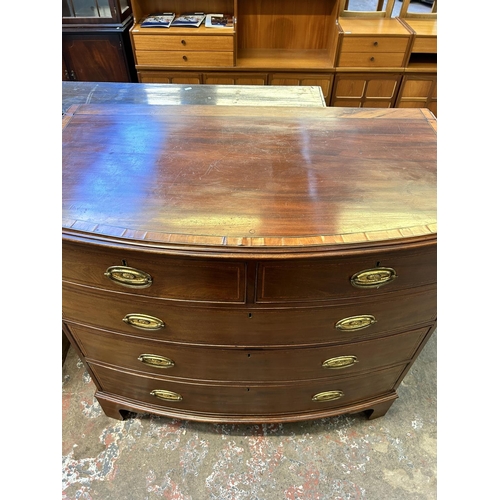 27 - A Georgian mahogany bow fronted chest of drawers on bracket supports with satinwood and ebony crossb... 