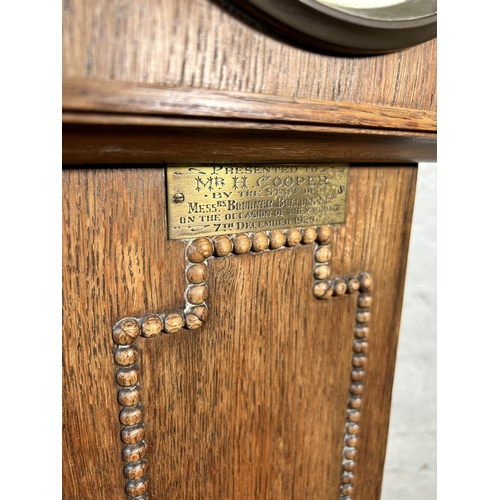 33 - A 1920s oak cased chiming Granddaughter clock with beaded decoration and barley twist supports - app... 