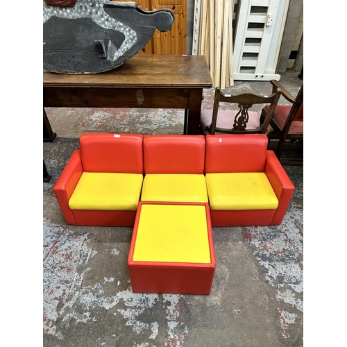 36 - A modern red and yellow leatherette three piece child's modular sofa and coffee table - approx. 46cm... 