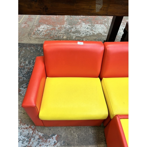 36 - A modern red and yellow leatherette three piece child's modular sofa and coffee table - approx. 46cm... 