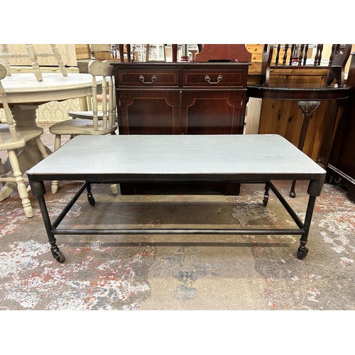 39 - A grey painted and black metal industrial style coffee table on castors - approx. 46cm high x 60cm w... 