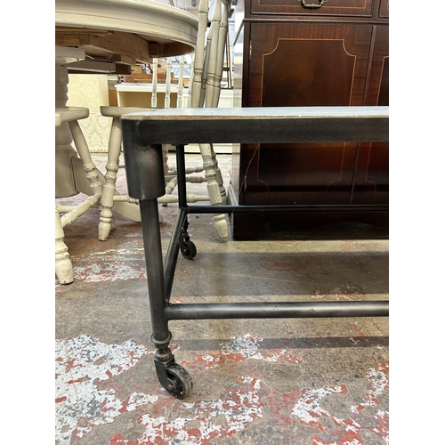 39 - A grey painted and black metal industrial style coffee table on castors - approx. 46cm high x 60cm w... 