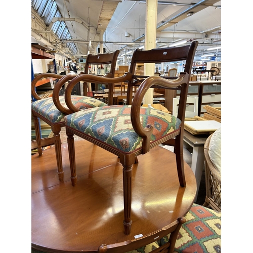 46 - A yew wood circular extending dining table and eight chairs - approx. 79cm high x 137cm diameter