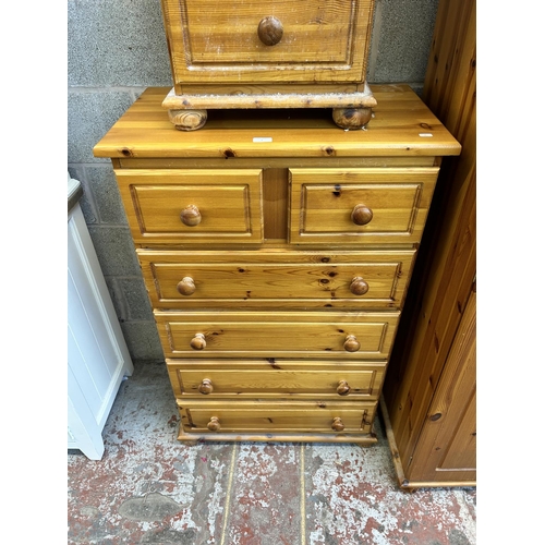 5 - A pine three piece bedroom suite comprising double wardrobe, chest of drawers and bedside chest of d... 