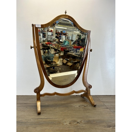 64 - An Edwardian satinwood inlaid walnut framed shield shaped bevelled edge dressing table mirror - appr... 