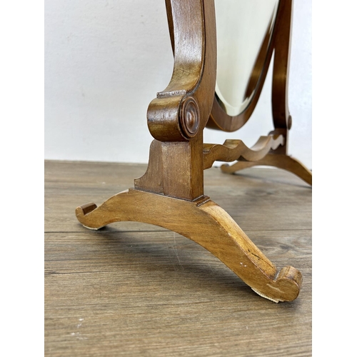 64 - An Edwardian satinwood inlaid walnut framed shield shaped bevelled edge dressing table mirror - appr... 