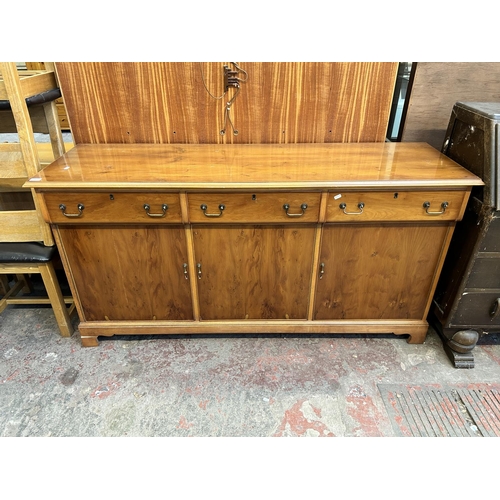 65 - A yew wood sideboard - approx. 87cm high x 170cm wide x 53cm deep