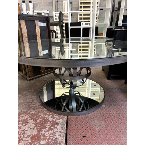 72 - A brushed steel and mirrored glass circular coffee table - approx. 61cm high x 130cm diameter