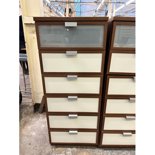 77 - A pair of IKEA Hopen walnut effect chests of drawers - approx. 125cm high x 50cm wide x 49cm deep