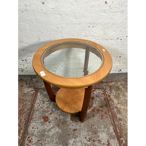 79 - A Nathan teak and glass circular two tier side table - approx. 55cm high x 50cm diameter