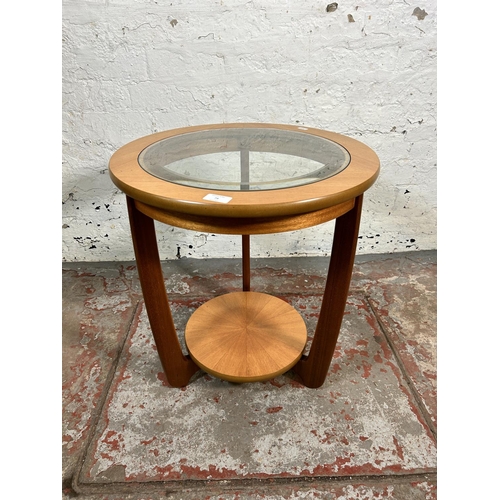 79 - A Nathan teak and glass circular two tier side table - approx. 55cm high x 50cm diameter