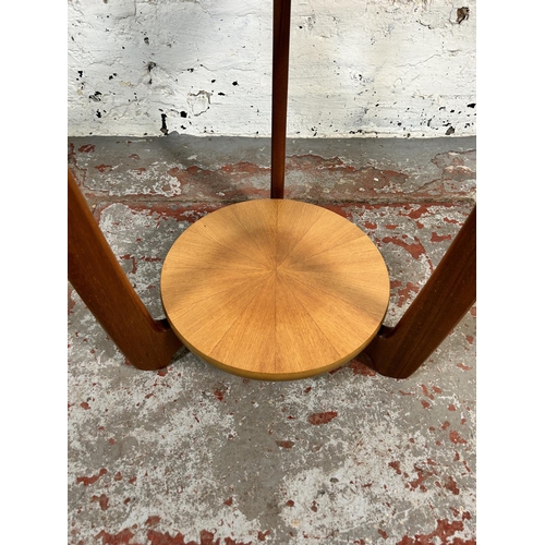 79 - A Nathan teak and glass circular two tier side table - approx. 55cm high x 50cm diameter