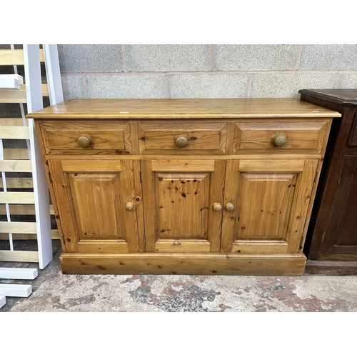 8 - A Victorian style solid pine sideboard - approx. 81cm high x 122cm wide x 46cm deep