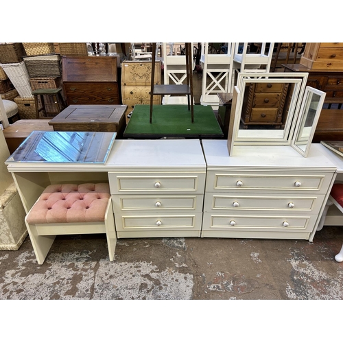 82 - A white laminate two piece bedroom suite comprising dressing table and chest of drawers