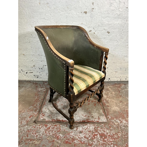 85 - An early/mid 20th century beech and green leather barley twist armchair with Regency stripe upholste... 