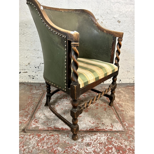 85 - An early/mid 20th century beech and green leather barley twist armchair with Regency stripe upholste... 