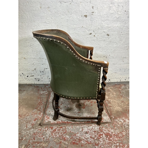 85 - An early/mid 20th century beech and green leather barley twist armchair with Regency stripe upholste... 