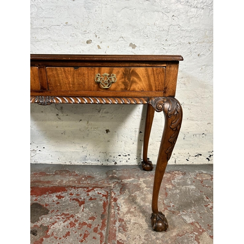 86 - An early 20th century Chippendale style carved mahogany two drawer lowboy/side table on ball and cla... 