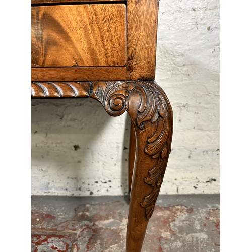 86 - An early 20th century Chippendale style carved mahogany two drawer lowboy/side table on ball and cla... 