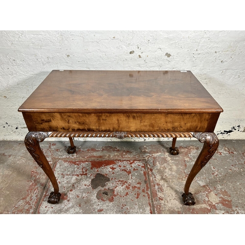 86 - An early 20th century Chippendale style carved mahogany two drawer lowboy/side table on ball and cla... 