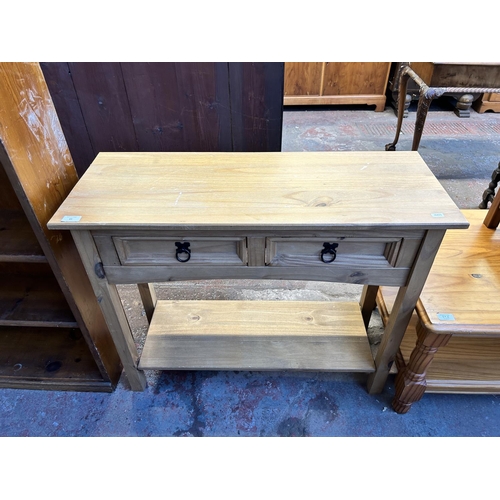 89 - A Mexican pine two drawer console table - approx. 74cm high x 90cm wide x 35cm deep