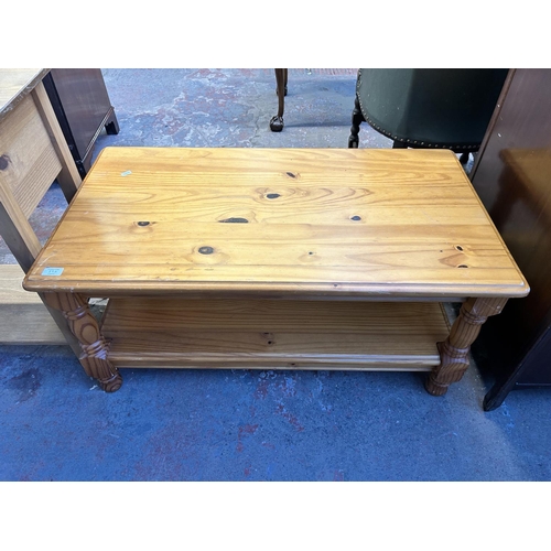 89A - A pine rectangular two tier coffee table - approx. 46cm high x 55cm wide x 100cm long