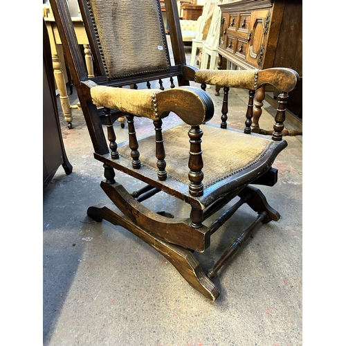 92 - An early 20th century American beech and brown fabric upholstered rocking chair