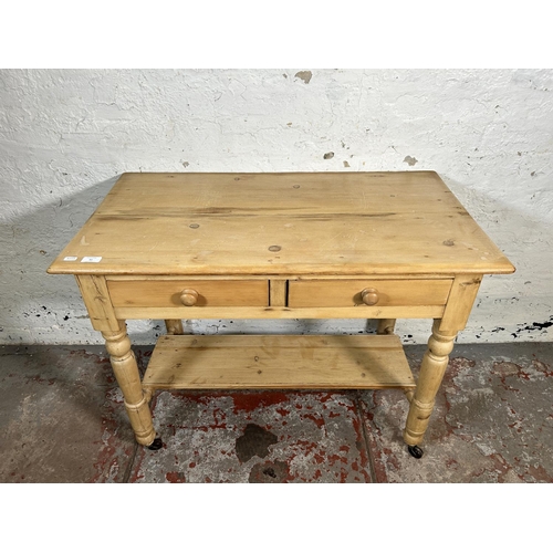 93 - A Victorian pine two drawer wash stand/console table - approx. 73cm high x 95cm wide x 52cm deep