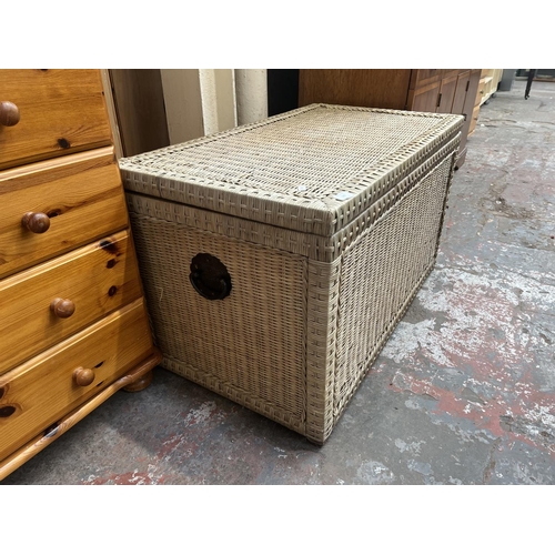 183 - A wicker blanket box with black metal handles - approx. 53cm high x 92cm wide x 52cm deep