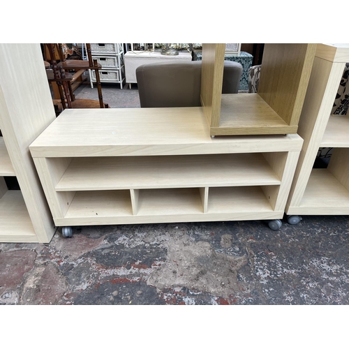 185 - Four pieces of modern furniture, oak effect and white laminate side table, two IKEA Kallax shelving ... 