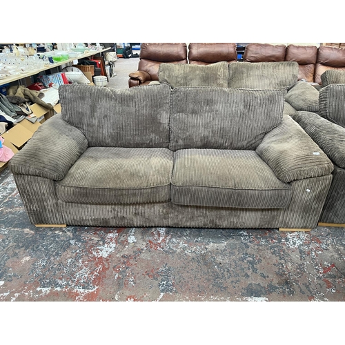 192 - A modern grey fabric upholstered three seater sofa - approx. 83cm high x 210cm wide x 94cm deep